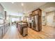 Kitchen with stainless steel appliances and view into dining and living areas at 1122 Saratoga Blvd, Indian Trail, NC 28079