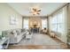 Bright and airy living room with hardwood floors, neutral decor, and a cozy seating arrangement at 1122 Saratoga Blvd, Indian Trail, NC 28079