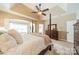Comfortable main bedroom with a four-poster bed, ceiling fan and a sitting area at 1122 Saratoga Blvd, Indian Trail, NC 28079