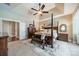 Bright main bedroom with a four-poster bed, ceiling fan and neutral colored carpet at 1122 Saratoga Blvd, Indian Trail, NC 28079