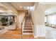 Bright foyer showcasing staircase with wood treads and white risers and banister at 1122 Saratoga Blvd, Indian Trail, NC 28079