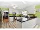 Bright eat-in kitchen with white cabinets, stainless appliances, and a stylish tile floor at 1210 Brookwood Dr, Shelby, NC 28150