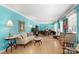 Spacious living room with hardwood floors, bright blue walls, and abundant natural light at 1210 Brookwood Dr, Shelby, NC 28150