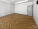 Bright and airy bedroom features wood floors and neutral walls at 12326 Cranberry Glades Dr, Cornelius, NC 28031