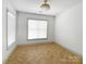 Cozy bedroom featuring a window and ample natural light at 12326 Cranberry Glades Dr, Cornelius, NC 28031