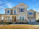 Charming two-story home features stone accents, a covered porch, and an attached two-car garage at 12326 Cranberry Glades Dr, Cornelius, NC 28031