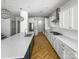Modern kitchen with pendant lights, stainless steel appliances, white cabinets, and a spacious island at 12326 Cranberry Glades Dr, Cornelius, NC 28031