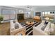 Bright living room boasts a fireplace, ceiling fan, and sliding glass doors for seamless indoor-outdoor living at 12326 Cranberry Glades Dr, Cornelius, NC 28031