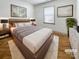 Serene bedroom with plush rug, modern furnishings, and soft, neutral tones for a relaxing retreat at 12326 Cranberry Glades Dr, Cornelius, NC 28031