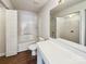 Clean bathroom with white fixtures, tile, vanity, and large mirror at 12616 Tucker Crossing Ln, Charlotte, NC 28273