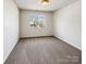 Bright and open bedroom with neutral walls, large window providing ample natural light at 12616 Tucker Crossing Ln, Charlotte, NC 28273