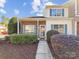 Charming townhouse featuring a mix of brick and siding, complemented by manicured landscaping at 12616 Tucker Crossing Ln, Charlotte, NC 28273