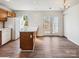 Bright kitchen with white appliances, wood cabinets, and wood-look flooring at 12616 Tucker Crossing Ln, Charlotte, NC 28273