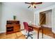 Cozy home office with hardwood floors, desk, and a view of the stairs at 12811 Elkhorn Dr, Charlotte, NC 28278