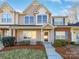 Charming townhome with landscaped front yard, brick accents, and a welcoming entryway at 13510 Tranters Creek Ln, Charlotte, NC 28273