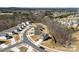 Overview of homes in a community with tree-lined streets and spacious lots at 14030 Turncloak Dr, Charlotte, NC 28278