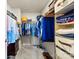 Organized walk-in closet with hanging clothes, folded items, and shoe storage at 14030 Turncloak Dr, Charlotte, NC 28278