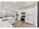 Bright kitchen with white cabinets, stainless steel appliances, and wood look flooring at 14030 Turncloak Dr, Charlotte, NC 28278