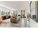 Open-concept living room with fireplace, large TV, stylish furnishings, and natural light at 14030 Turncloak Dr, Charlotte, NC 28278