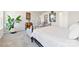 Bright main bedroom featuring neutral walls, carpet, and a decorative iron bed frame at 14030 Turncloak Dr, Charlotte, NC 28278