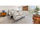 The main bedroom featuring an ornate bed frame, hardwood furniture, and an abundance of natural light at 14030 Turncloak Dr, Charlotte, NC 28278