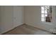 A bright bedroom with a window and neutral carpet flooring at 1411 Swaying Branch Ln, Clover, SC 29710