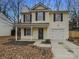 Charming two-story home with a well-maintained lawn and attached garage at 1411 Swaying Branch Ln, Clover, SC 29710