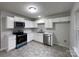 Functional kitchen with white cabinets, stainless steel appliances and ample counter space at 1411 Swaying Branch Ln, Clover, SC 29710