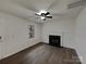 Cozy living room featuring a fireplace, window, and neutral color palette at 1411 Swaying Branch Ln, Clover, SC 29710
