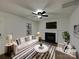 Bright living room featuring modern furniture, fireplace, and neutral color palette at 1411 Swaying Branch Ln, Clover, SC 29710
