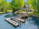 Aerial view of the lakefront house, dock with gazebo and boat lift providing stunning waterfront living at 16 Sunrise Point Ct, Lake Wylie, SC 29710
