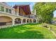 Spacious backyard featuring lush lawn, landscaping, outdoor living spaces and waterfront views at 16 Sunrise Point Ct, Lake Wylie, SC 29710