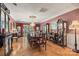 Elegant dining room with a long table, chandelier and hardwood floors at 16 Sunrise Point Ct, Lake Wylie, SC 29710