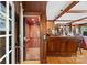 Interior shot of an elevator with wooden paneling and a bookshelf at 16 Sunrise Point Ct, Lake Wylie, SC 29710