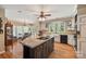 Kitchen featuring central island and modern appliances, with a view of the outdoors at 16 Sunrise Point Ct, Lake Wylie, SC 29710