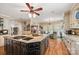 Spacious kitchen featuring central island, bar top and hardwood floors at 16 Sunrise Point Ct, Lake Wylie, SC 29710