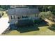Attractive single-Gathering home featuring a well-manicured lawn, mature trees, and a cozy front porch at 1661 California Rd, York, SC 29745