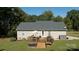 Outdoor living is easy on this deck for entertaining and dining with lush surroundings at 1661 California Rd, York, SC 29745