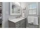 Bright bathroom featuring a new vanity, neutral walls, framed mirror and a shower/tub combo at 1661 California Rd, York, SC 29745