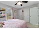 Comfortable bedroom with soft pink tones featuring natural light and ample closet space at 1661 California Rd, York, SC 29745