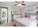 Comfortable bedroom with soft pink tones featuring natural light and ceiling fan at 1661 California Rd, York, SC 29745