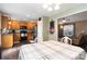 Inviting dining room open to the kitchen with modern light fixture and light walls at 1661 California Rd, York, SC 29745