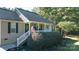 Charming home featuring a covered front porch, classic siding, and beautiful landscaping enhancing its curb appeal at 1661 California Rd, York, SC 29745