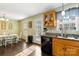 A cozy eat in kitchen with granite countertops and wood cabinets with a stainless steel sink at 1661 California Rd, York, SC 29745