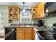 Kitchen featuring wooden cabinets and granite countertops, with a stainless steel sink at 1661 California Rd, York, SC 29745