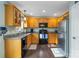Charming kitchen featuring wooden cabinets, granite countertops and stainless steel refrigerator at 1661 California Rd, York, SC 29745
