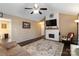 A vaulted living room with a fireplace and mounted television and a ceiling fan at 1661 California Rd, York, SC 29745
