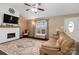 Bright living room featuring a fireplace, large windows, comfortable seating, and a cozy atmosphere at 1661 California Rd, York, SC 29745