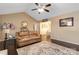 Spacious living room featuring hardwood floors, neutral paint, comfortable seating, and tasteful decor at 1661 California Rd, York, SC 29745