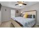 Comfortable main bedroom with a ceiling fan, light colored walls, and natural light at 1661 California Rd, York, SC 29745
